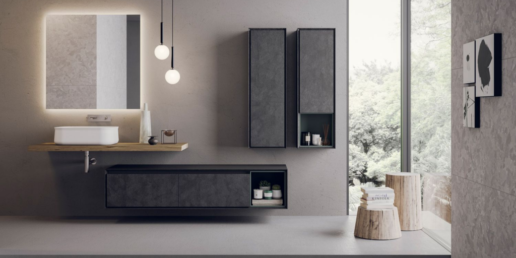 Grey tiled bathroom featuring black bathroom furniture, hight tech big wall mirror and huge windows.